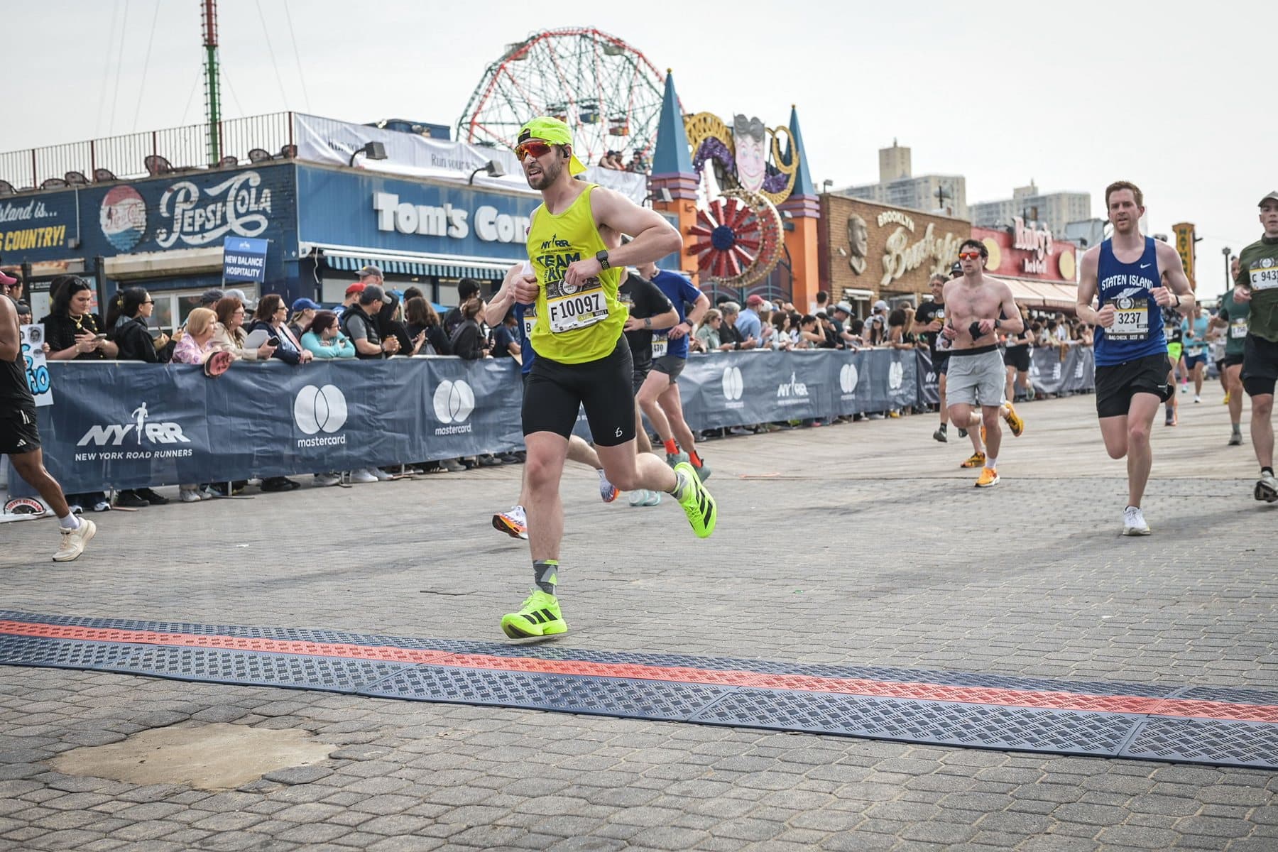 Daniel running past the Coney Island boardwalk near the finish of the Brooklyn Half